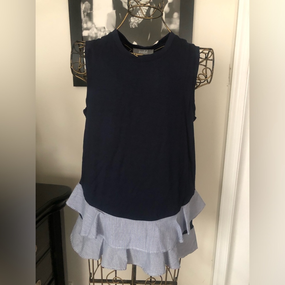 Sleeveless top with ruffles on the bottom